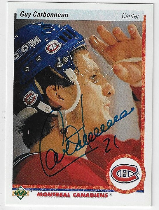 Signed Montreal Canadiens hockey card of Guy Carbonneau in blue helmet and red jersey, 1990-91 season